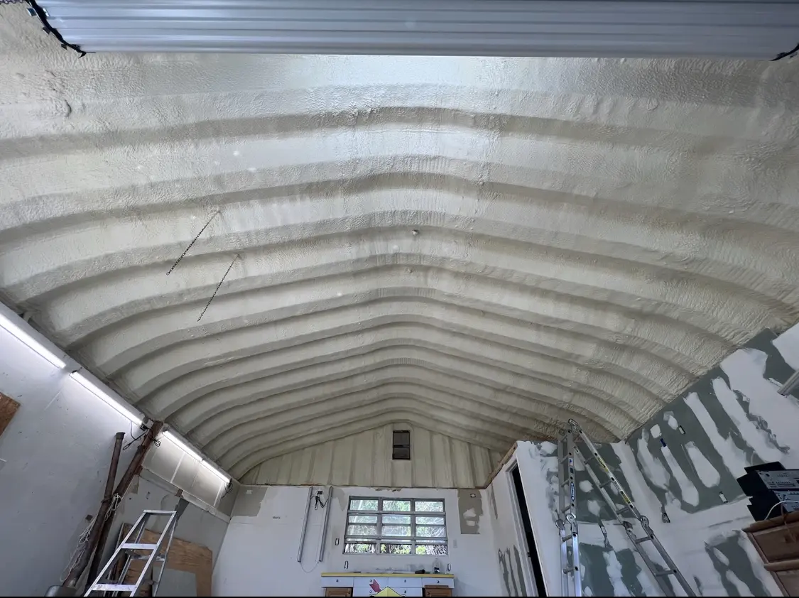 Spray polyurethane foam applied to the underside of a metal roof deck in East Riverdale